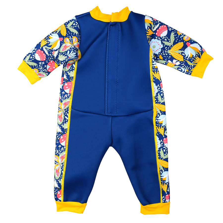 Fleece-lined baby wetsuit in navy blue with yellow trims and flowers print. Back.